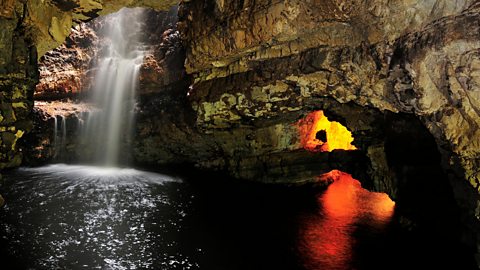 Underground waterfall in a cave