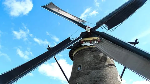 Ann Babe At Kinderdijk, windmill sails spin and whip around (Credit: Ann Babe)