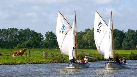 David R Frazier Photolibrary, Inc /Alamy Sailboats travel on canals near Leiden (Credit: David R Frazier Photolibrary, Inc /Alamy)