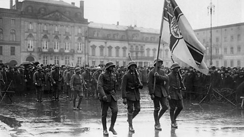 Photo showing Putschists marching with the Imperial War Flag at Pariser Platz Square.