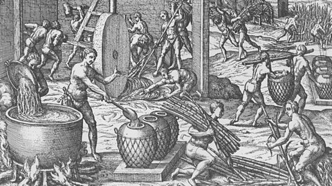 Illustration of sugar manufacturing and refining from De Bry's voyages in the 16th century.
