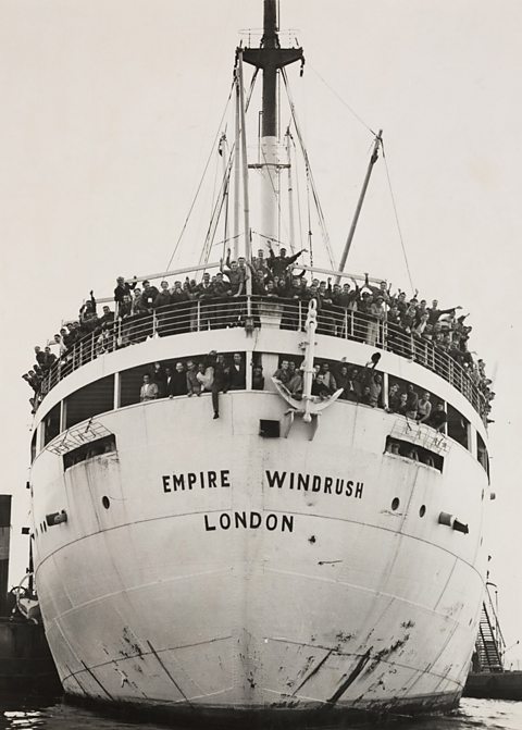 A photograph of SS Empire Windrush docking at Tilbury, having sailed from Australia via Jamaica, with crowds of waving passengers