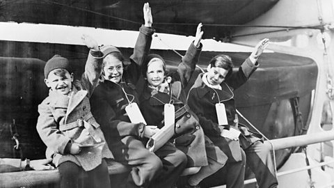 A photograph of four young members of the largest group of German-Jewish refugees arrive at Southampton on the US liner 'Manhattan' in March 1939.