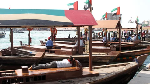 Joseph Mortimer Abras: short, nippy wooden dhows with open sides and simple roofs that act as water taxis (Credit: Joseph Mortimer)