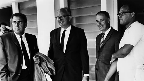WordClerk/Creative Commons Attribution-Share Alike 3.0 Gerald Bull, at far left, photographed at the Space Research Institute, McGill University, Canada in 1964 (Credit: WordClerk/CC BY-SA 3.0)