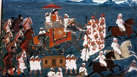 Heritage Image Partnership Ltd/Alamy A British East India Company official rides with his escort of foot soldiers and Indian retainers (Credit: Heritage Image Partnership Ltd/Alamy)