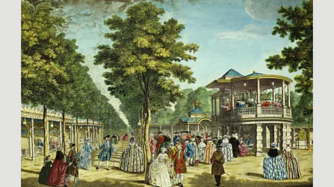 Company workers enjoyed numerous public holidays to relax, like people shown here in Vauxhall Gardens in 1751 (The Art Archive/Alamy)