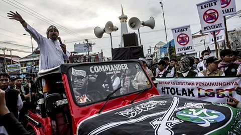 Getty Images Anti-LGBT activists protest on February 23, 2016 in Yogyakarta, Indonesia (Credit: Getty Images)
