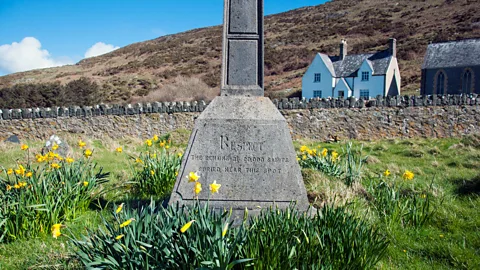 Amanda Ruggeri In the chapel graveyard, an inscription honours the 20,000 saints said to be buried nearby (Credit: Amanda Ruggeri)