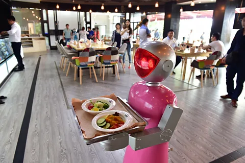 ChinaFotoPress/ GettyImages Moving up the ladder from waitressing soon robots may be handling your financial planning (Credit:ChinaFotoPress/ GettyImages)