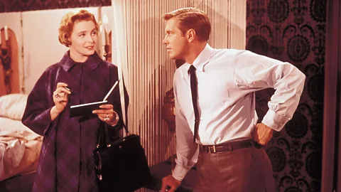 Alamy Paul (George Peppard) is also a kept man – his interior decorator (an older woman) leaves him cash after their romantic trysts (Credit: Alamy)