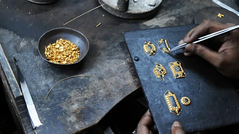 Dibyangshu Sarkar/AFP/Getty More than half of the world’s gold goes to jewellery, like at this artisan’s shop in Kolkata, India (Credit: Dibyangshu Sarkar/AFP/Getty)