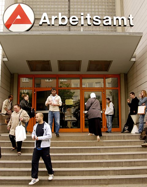 Job seekers enter and leave the Arbeitsamt or German Labour Office in the Wedding district of Berlin, Germany