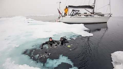 Daniel Hug The captain and author prepared to dive under the ice. (Credit: Daniel Hug)