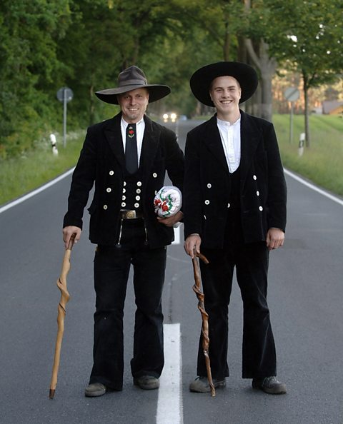 Two carpenters in traditional clothing