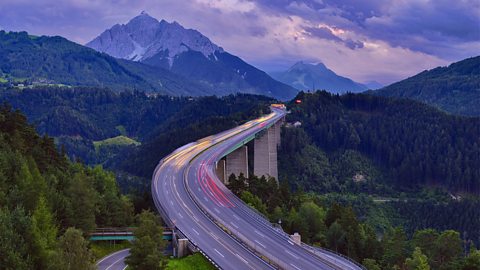 Highway bridge in the mountains, sunset.
