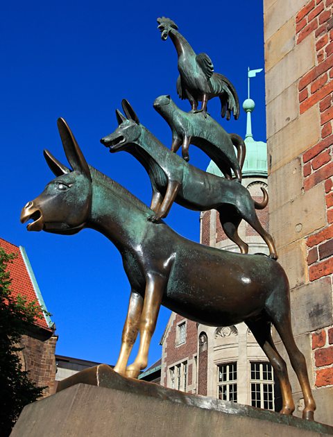 Statue of the Bremen town musicans under blue sky, Hanseatic City of Bremen, Germany, Europe