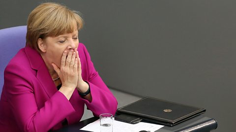 German Chancellor Angela Merkel yawns after giving a government declaration during a meeting of the Bundestag, the German federal parliament, on June 4, 2014 in Berlin, Germany.