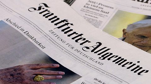 Editions of the Frankfurter Allgemeine Zeitung and the Frankfurter Rundschau newspapers lying at a news stand