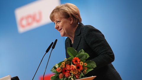 German Chancellor and Chairwoman of the German Christian Democrats (CDU) Angela Merkel speaks to delegates after she was re-elected as party chairwoman at the annual CDU party congress