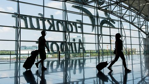Passengers pull their luggage inside terminal 2 of Frankfurt Airport