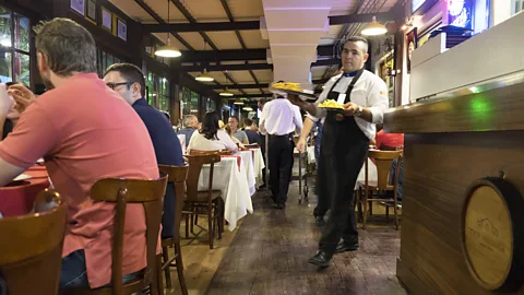 Roberto Baibich Local churrascarias like Churrascaria Barranco bustle in Brazil (Credit: Roberto Baibich)
