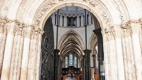 Amanda Ruggeri Peering through the original stone entrance of Temple Church (Credit: Amanda Ruggeri)