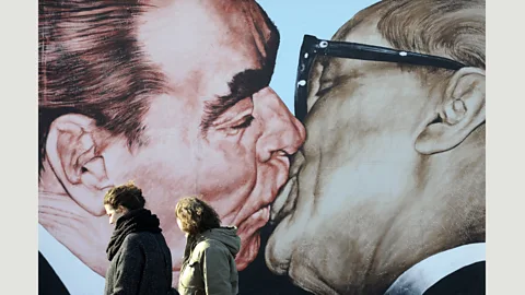 John Macdougall/AFP/Getty Images The new mural draws on this painting by Dmitry Vrubel, showing the Soviet leader Leonid Brezhnev and East German leader Erich Honecker (Credit: John Macdougall/AFP/Getty Images)