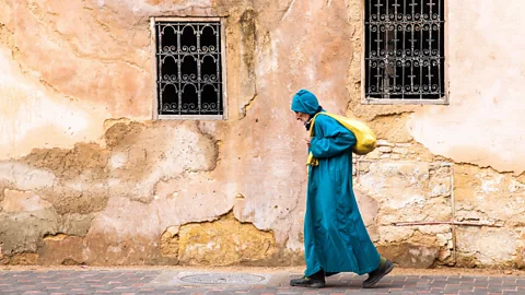 Nadia Isakova/Alamy A man wearing a traditional djellaba walks down the street in Fez (Credit: Nadia Isakova/Alamy)