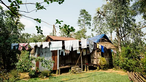 Tanveer Badal Homes in Mawlynnong are simple, typically made of bamboo and metal, and they – and their yards – are all immaculately clean (Credit: Tanveer Badal)