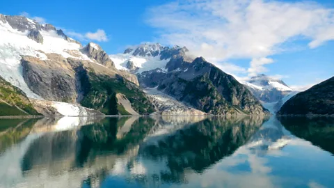 Kayak Adventures Worldwide Mountains stretch up from the sea to frame glacier-carved lagoons (Credit: Kayak Adventures Worldwide)