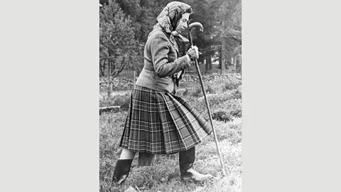 Getty Images From the 1950s the Queen’s Balmoral look has not changed – a tweed jacket or knitted twin-set, and a pleated Balmoral-tartan skirt (Credit: Getty Images)