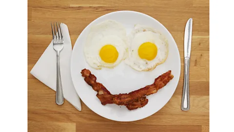 Getty Images A simple smile can be enough to get diners paying more (Credit: Getty Images)