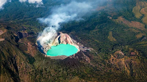 Denis Moskvinov/Alamy Sulphuric gases combined with dissolved metals makes Kawah Ijen Lake electric blue (Credit: Denis Moskvinov/Alamy)