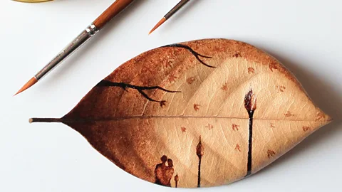 Ghidaq al-Nizar Indonesian artist Ghidaq al-Nizar uses coffee grounds on leaves, ceramics and melamine to create delicate art works (Credit: Ghidaq al-Nizar)