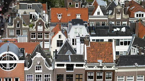 Jasper Juinen/Bloomberg/Getty Images The rooftops of traditional Dutch residential properties on a street in Amsterdam, The Netherlands (Credit: Jasper Juinen/Bloomberg/Getty Images)