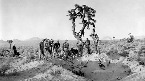 Los Angeles Public Library collection Military and local law enforcement personnel examine the crash site of the drone near Palmdale (Credit: Los Angeles Public Library collection)