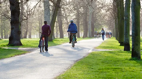 Alamy The definition of rest is personal - some people prefer a walk in the park, others might feel energised by listening to loud rock music (Credit: Alamy)