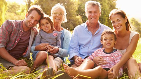 Multi-generation family relaxing together outdoors