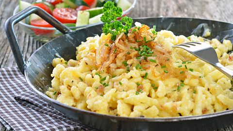 Southern German cheese noodles (spaetzle) in a serving pan