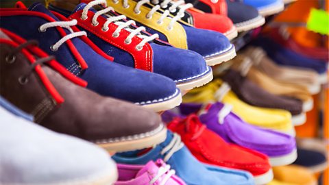 Counter with sport shoes at fashionable shop