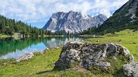 Mt. Zugspitze (highest mountain of Germany) with mountain lake in foreground