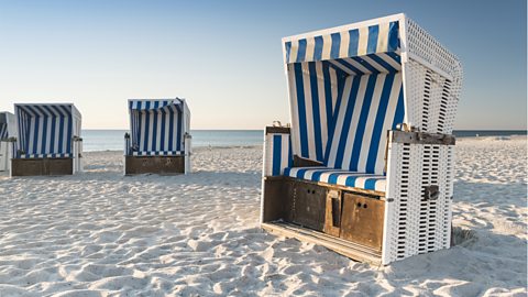 Beach chairs on the island Sylt on late afternoon