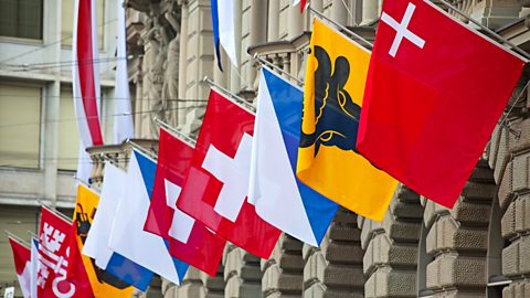 Flags with coats of arms of different cantons