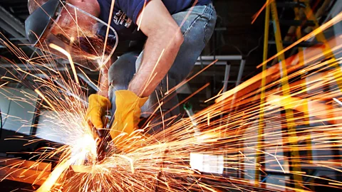 ZUMA Press Inc / Alamy Contractor Justin Holder cuts sheet metal for a firewall for a multimillion dollar renovation in Memphis, Tennessee, US (Credit: ZUMA Press Inc / Alamy)