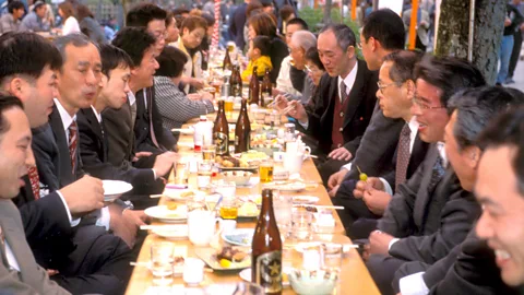 Alamy Often, corporate bonding occurs during late-night drinking sessions with colleagues (Credit: Alamy)