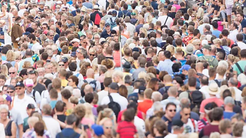 iStock Even in a large crowd, the unconscious mind is constantly on the look-out for the sound of someone calling our name (Credit: iStock)