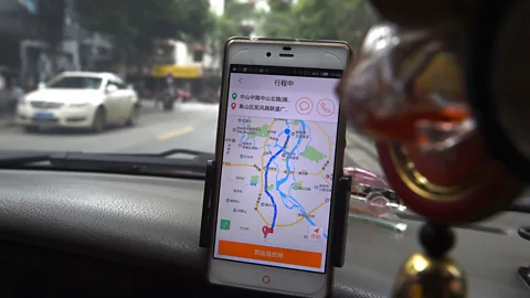 Getty Images A driver uses Didi Chuxing, China’s answer to Uber (Credit: Getty Images)