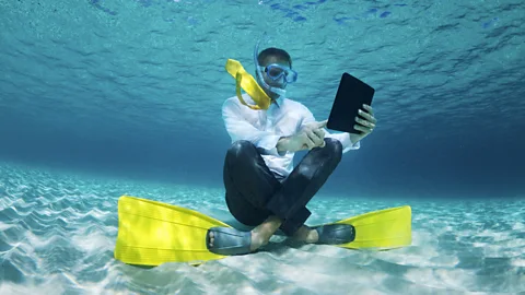 iStock In 2014, 42% of employees surveyed by Randstad said that they felt like they had to check in on work while on vacation. (Credit: iStock)