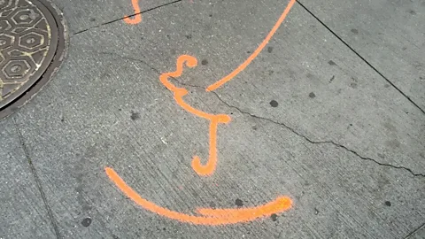 Jon Earle An Empire City Subway manhole cover and spray-painted markings indicating buried cable ducts (Credit: Jon Earle)